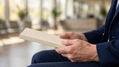 Candidate holding CV folder in a bright office waiting area — strengths and weaknesses interview answer guide 2026